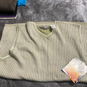 Another vintage large sweater vest by Quicksilver. Color is Tan